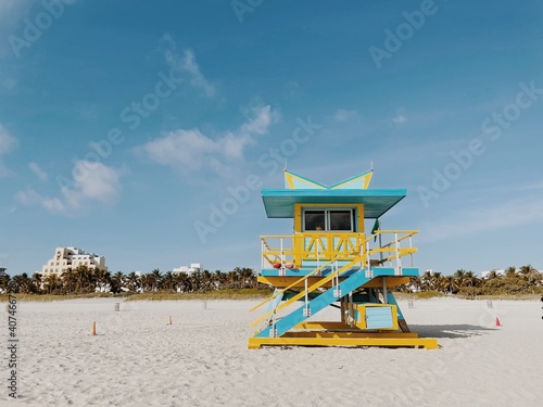 Beautiful Yellow and light blue lifeguard tower under a cloudy sunny sky in Miami Beach. Southern Florida, USA © Maria