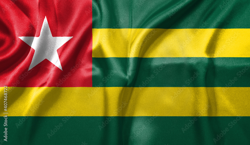 Togo flag wave close up. Full page Togo flying flag. Highly detailed realistic 3D rendering