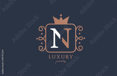 N monogram alphabet letter logo icon in white and blue color. Creative design with king crown for luxury business and company