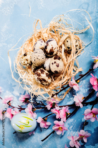 quail eggs inside nest in a easter background