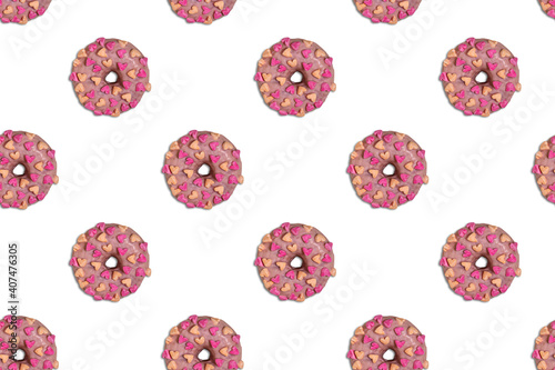 Diagonal seamless pattern with pink doughnuts with hearts on white background