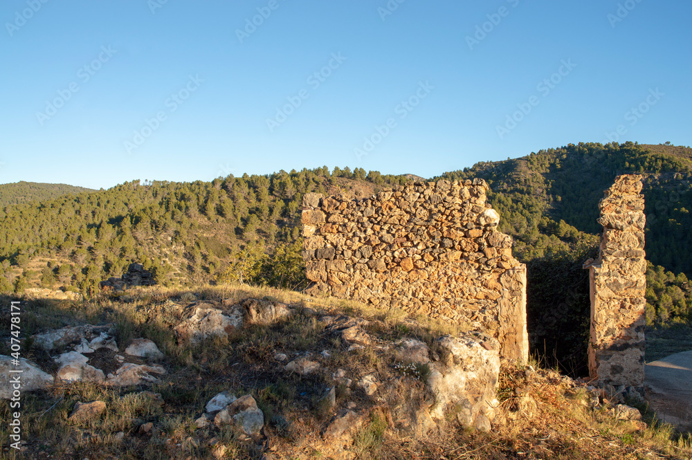 ruins of an old house located in the middle of the mountain and nature