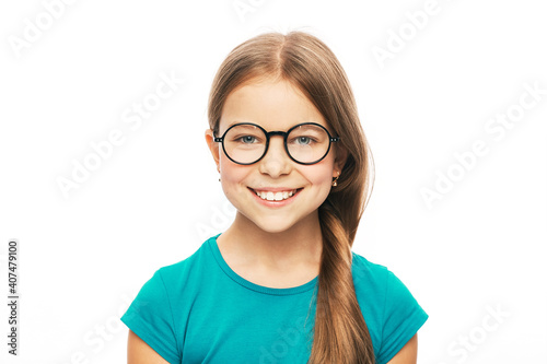 Vision correction for children. Smiling child with stylish eyeglasses isolated on white background