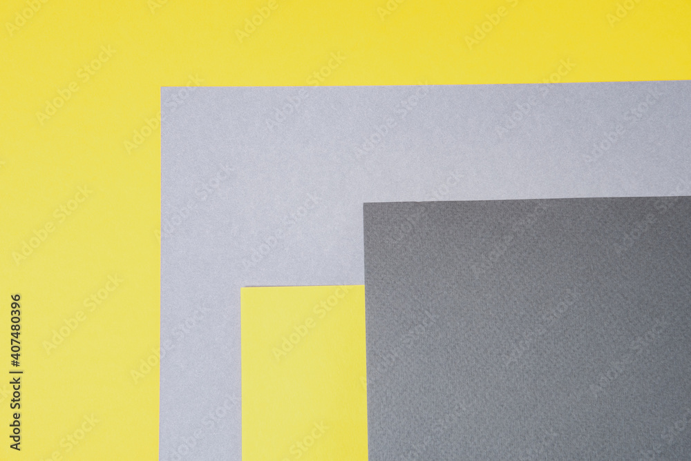 Fototapeta premium Gray and yellow paper top view. Template with geometric shapes for design in trendy colors with place for text