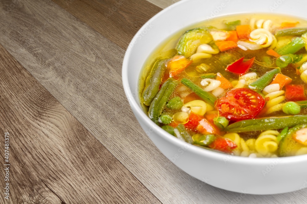 Bowl of delicious vegetable soup on a table Bowl of delicious vegetable soup on a table