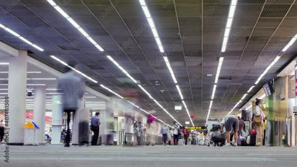 Timelapse landscape view inside the airport terminal with many passenger under covid19 corona virus crisis happens in Thailand