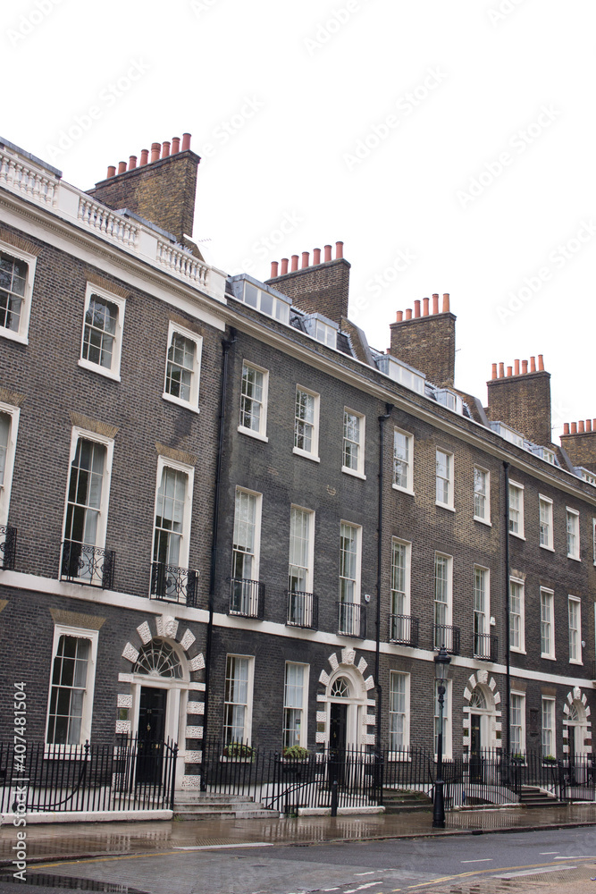 neat row of terraced town houses in the Bloomsbury area of London in England, UK