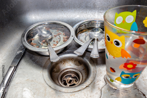 Dirty dishes in the sink. Calgary, Alberta, Canada photo