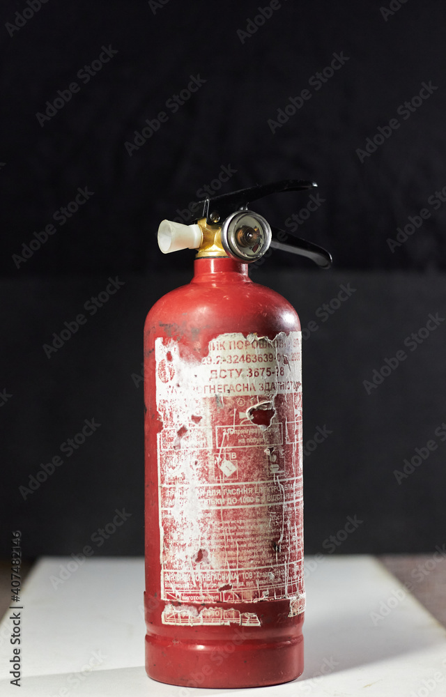 Obraz premium red fire extinguisher