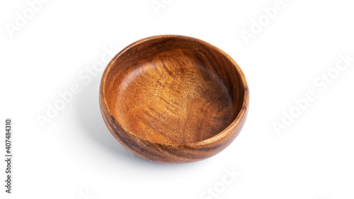 Empty wooden bowl isolated on a white background.