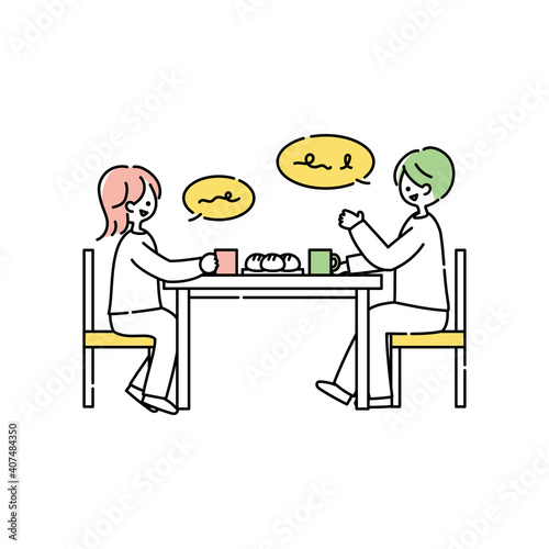 ダイニングテーブルで会話する夫婦