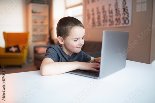 boy using a laptop computer © Gemütlichkeit