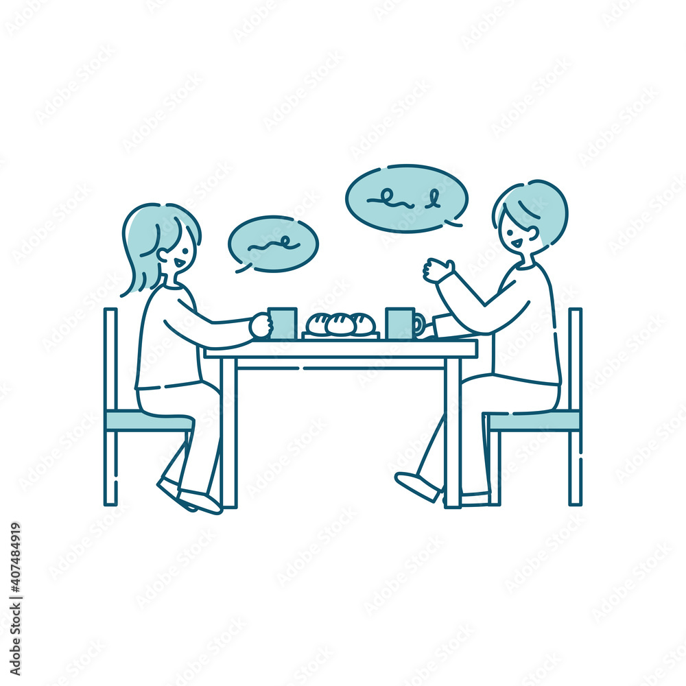 ダイニングテーブルで会話する夫婦
