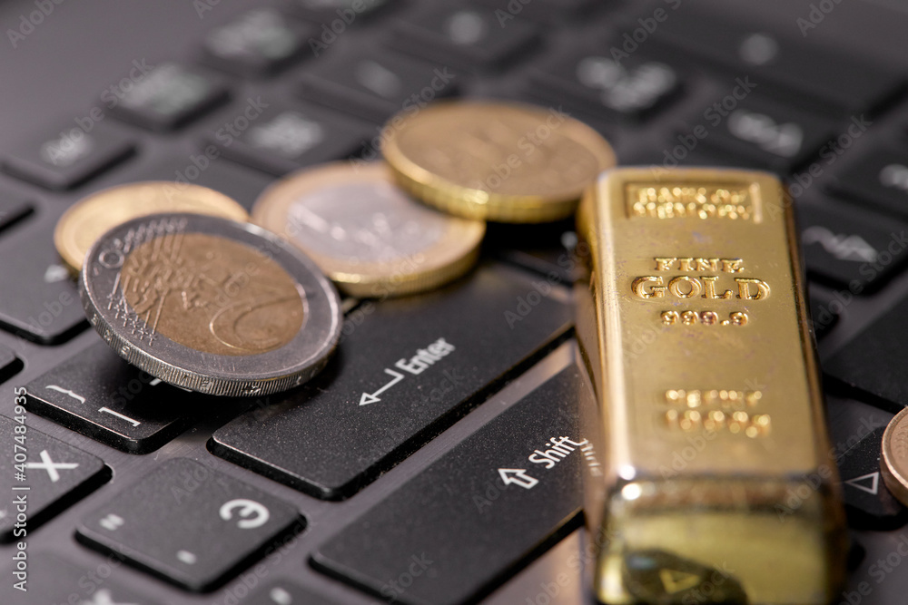 money coins on laptop computer money coins on laptop computer