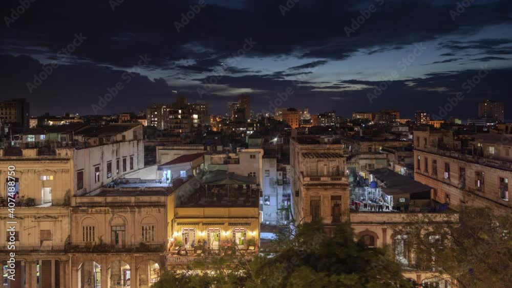Scenic sunset time lapse with Havana cityscape, Cuba island view. Clouds over world famous historic buildings with beautiful architecture. Light in windows where people living, night scene. Travel 4K