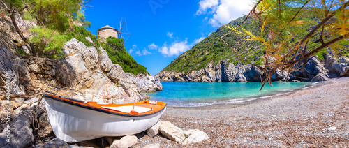 Gialia beach with old windmill in Alonnisos island, Greece. photo
