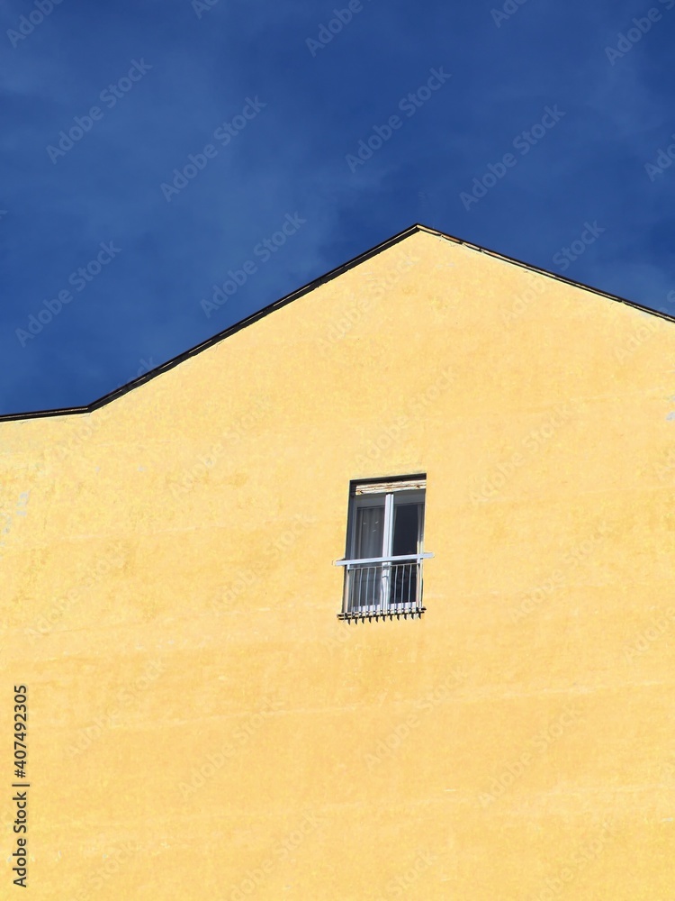 Small window frame on concrete wall building metaphor of social isolation caused by pandemic crisis Small window frame on concrete wall building metaphor of social isolation caused by pandemic crisis