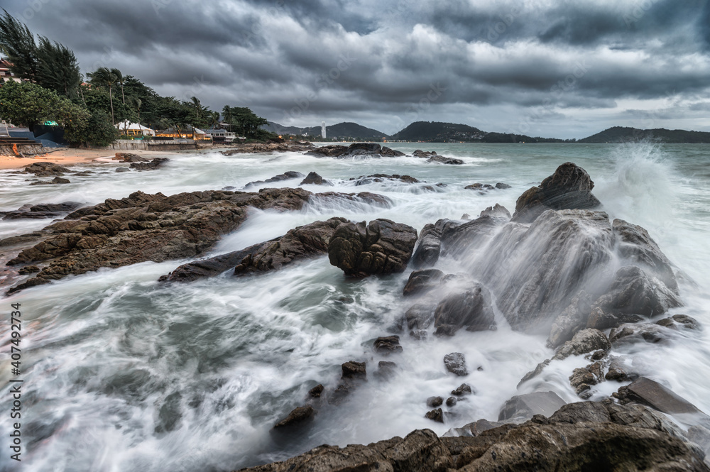 Ocean wave breaking at rocks on coastline in stormy Ocean wave breaking at rocks on coastline in stormy