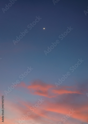 The crescent moon on colorful cloud in the blue sky at evening
