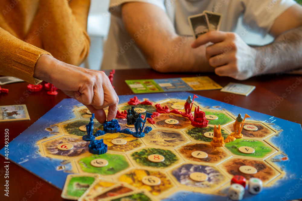 Balogunyom / Hungary - 01.04.2019: Board game party Settlers of Catan,  popular board game. Players are scrambling the area to get more resources  and victory points. Stock-bilde | Adobe Stock