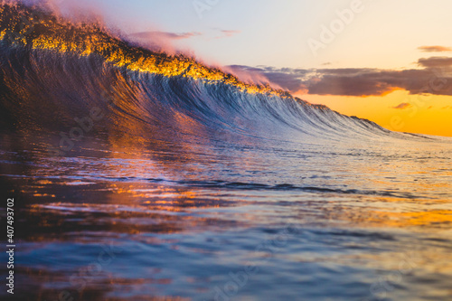 Colorful breaking wave at sunset © Benjamin