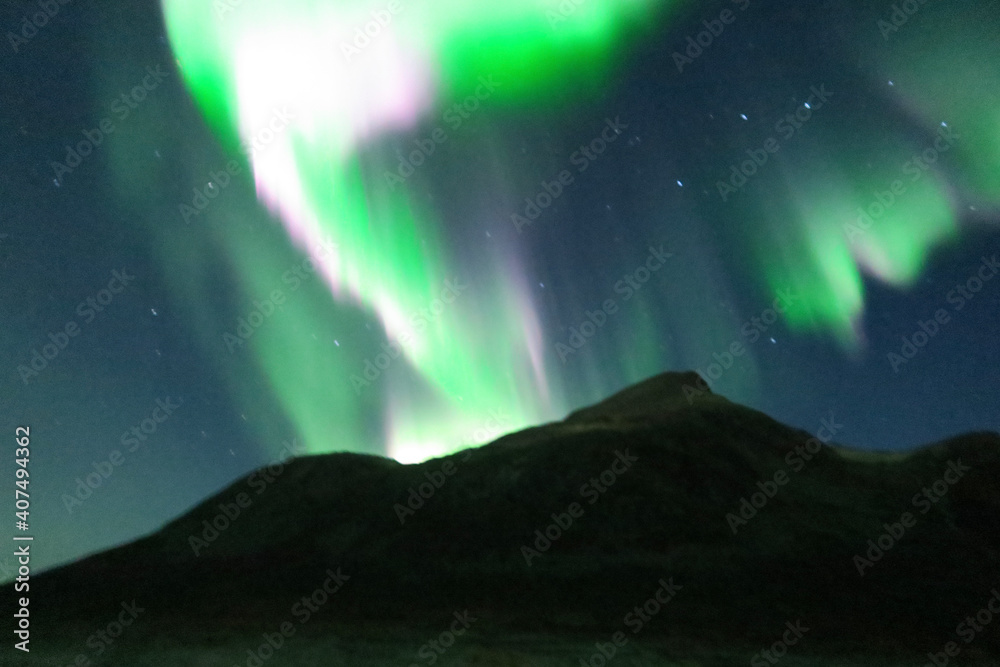 Fototapeta premium aurora borealis in the mountains