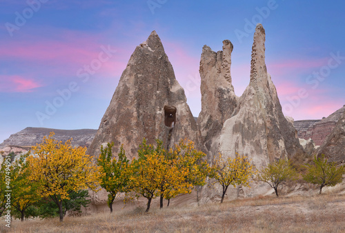 Panorama of unique geological formations in White valley at sunset in Cappadocia, Central Anatolia, Turkey photo