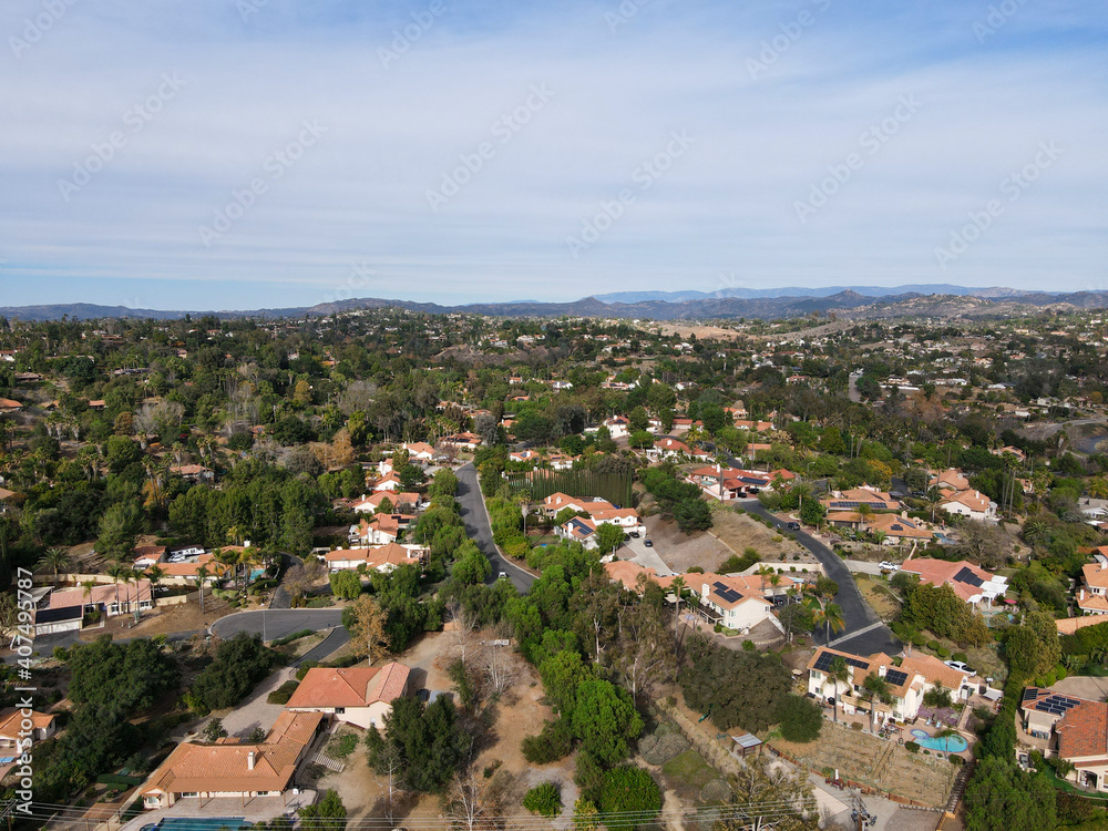 Fototapeta premium Aerial view of green valley with villas in The East Canyon Area of Escondido, San Diego, California