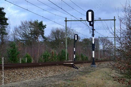 Obraz na plátne View of rails and signal posts from beside a train track in the Netherlands