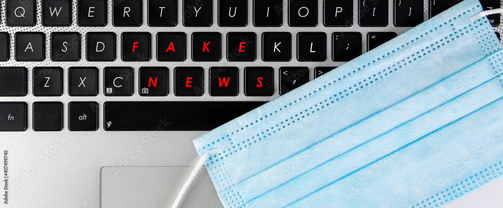 Words fake news written on a keyboard. Words fake news written on a keyboard.