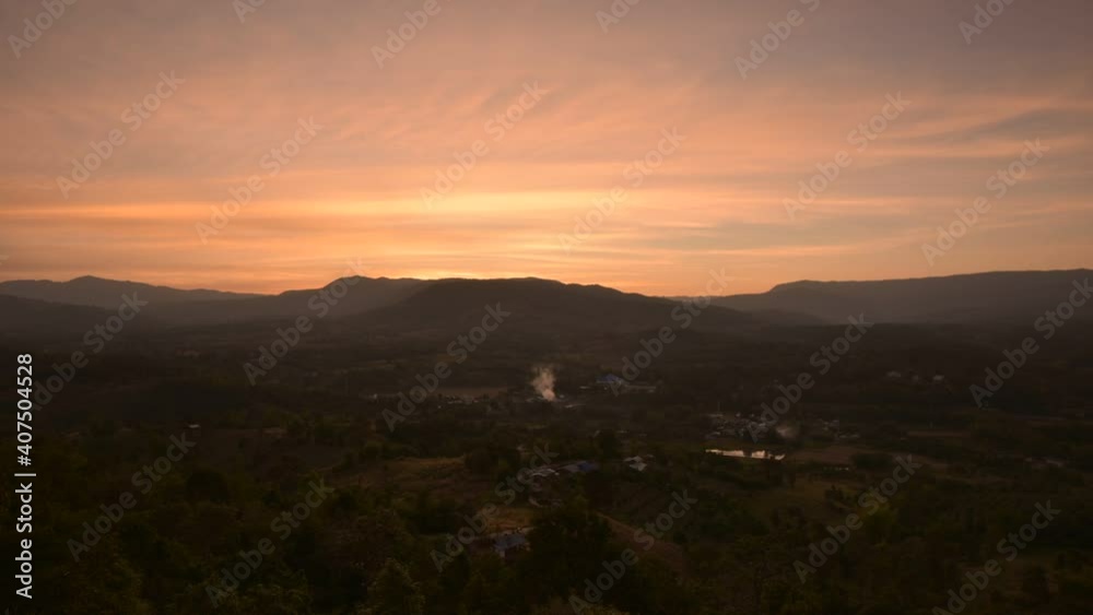 Sunset timelapse over a mountian range.Sunset over Mountains Timelapse Wide Shot Sunset timelapse over a mountian range.Sunset over Mountains Timelapse Wide Shot