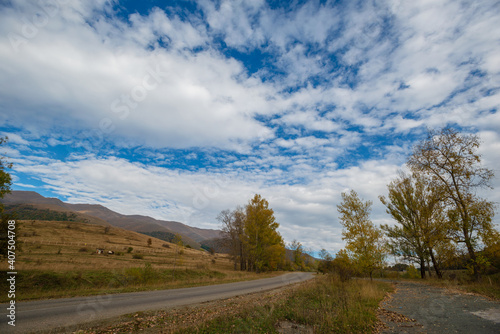 Beautiful autumn landscape with road anf fabulous clouds, Armenia