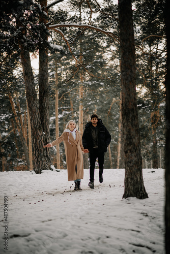 couple walking in the woods © Maryna