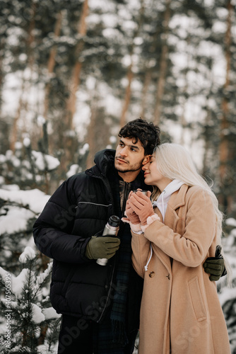 couple in winter forest