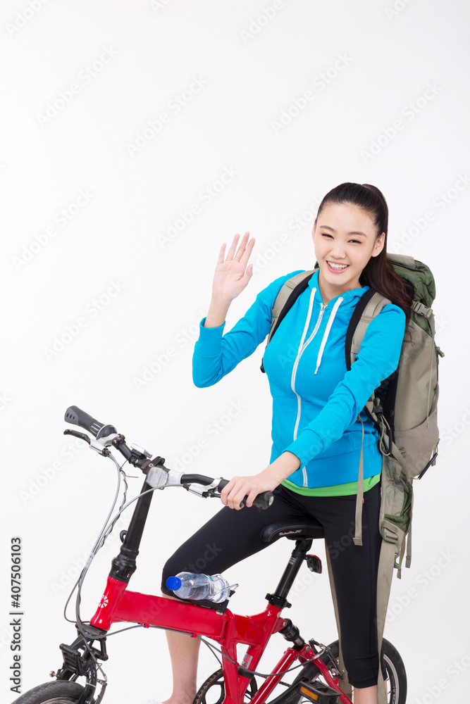 Young woman with backpack,taking a bike Young woman with backpack,taking a bike