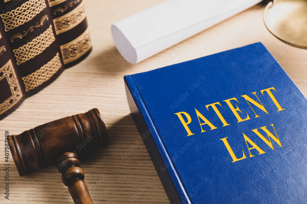 Patent Law book and gavel on wooden table Patent Law book and gavel on wooden table