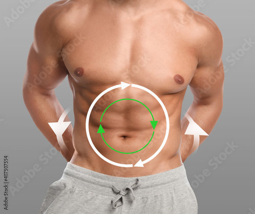 Metabolism concept. Man with perfect body on grey background, closeup