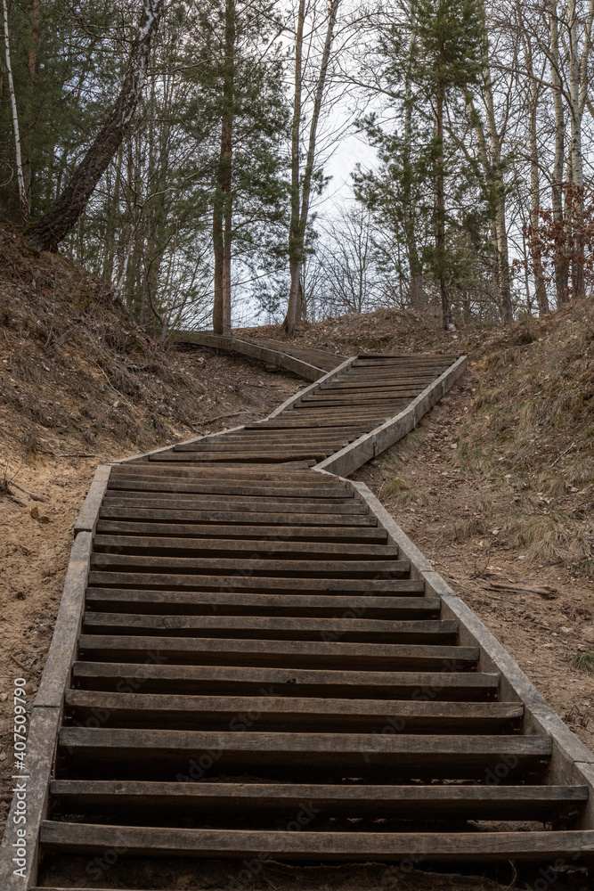 outdoors wooden stairs to climb a hill