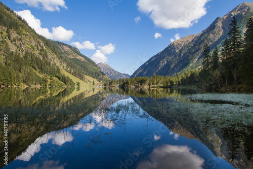 Fototapeta Naklejka Na Ścianę i Meble -  Idyllic mountain lake in the austrian alps with blue sky