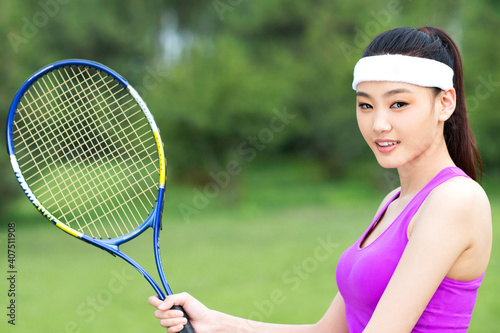 Young woman playing tennis © eastfenceimage