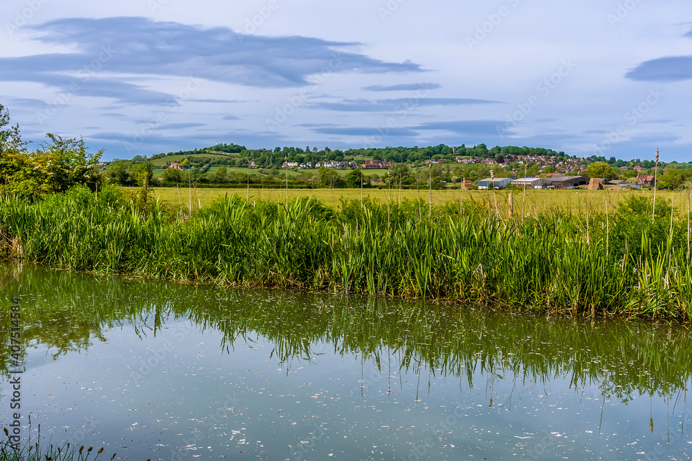 A view across the Oxford Canal towards the village of Napton, Warwickshire in summertime