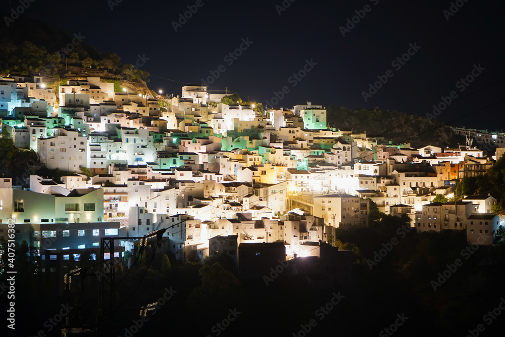 Typical spanish mountain village with its narrow white buildings in Andalusia at night