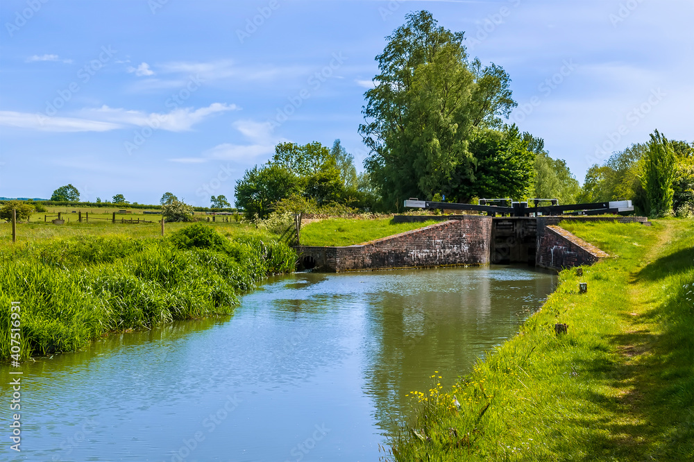 A view towards Adkins Lock on the Oxford Canal near to the village of Napton, Warwickshire in summertime