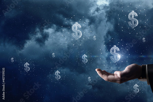 Hand supports the dollar hologram on the background of outer space.