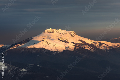 View of Larrun mountain covered by snow at a winter evening; Basque Country.