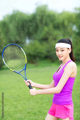 Young woman playing tennis © eastfenceimage