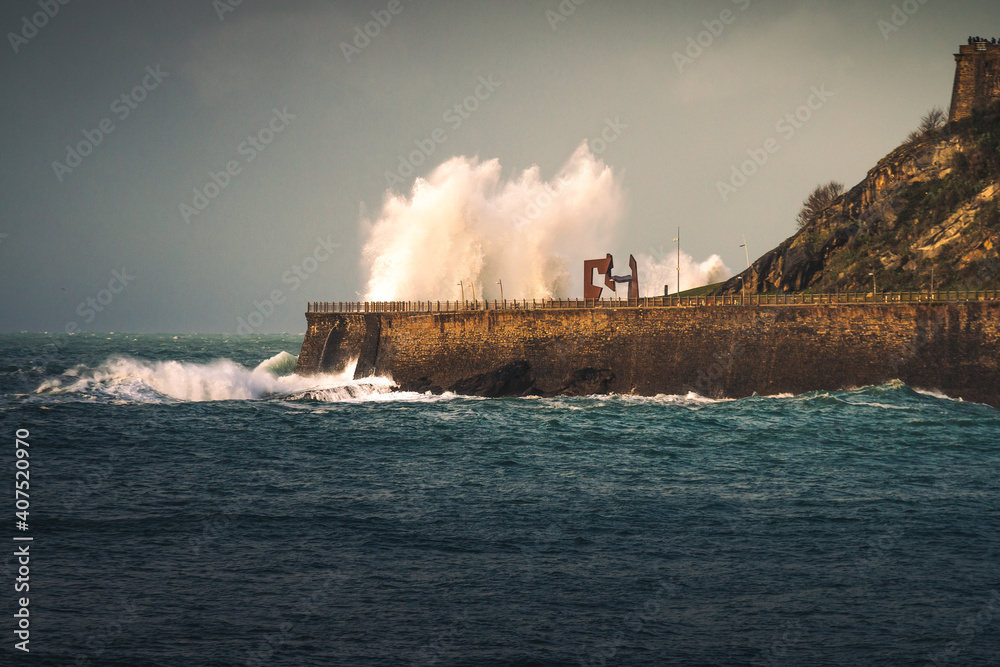 Obraz premium Big waves hitting the coast at Donostia-San Sebastian; Basque Country.