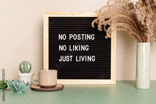 No posting, no liking, just living motivational quote on the letter board. Inspiration text for digital detox photo