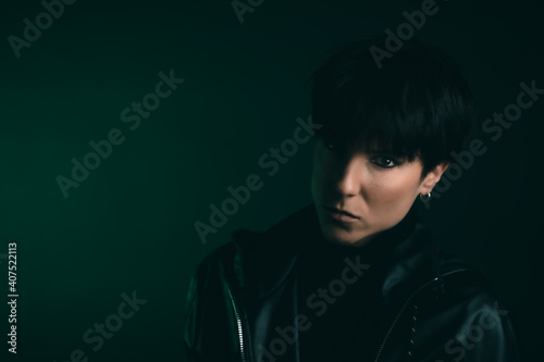 Portrait of a confident woman looking at camera in studio