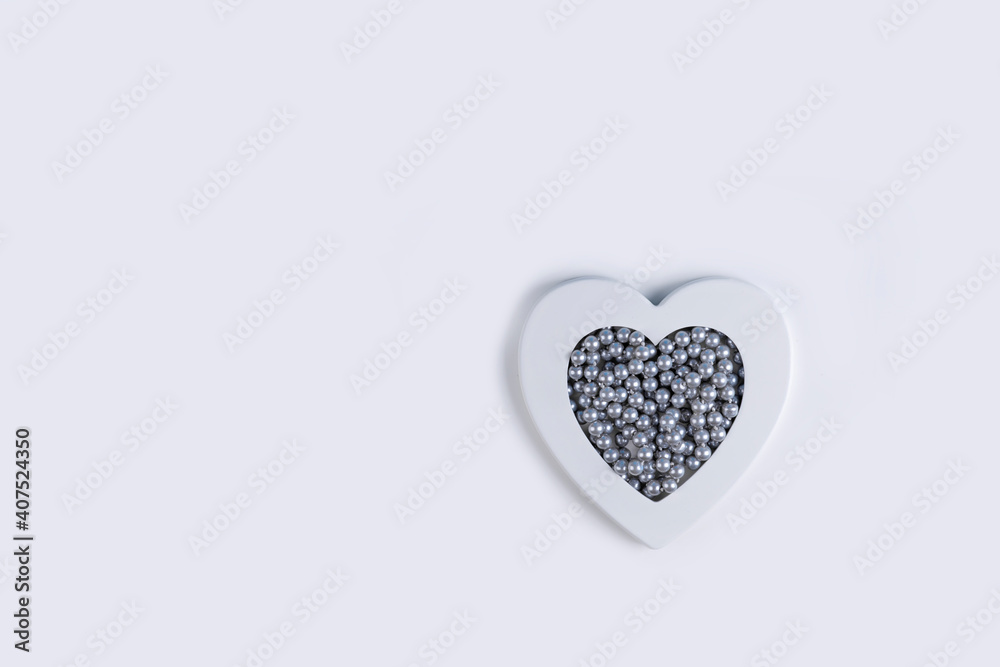 White heart with grey pearls. Minimal Valentines day background with copy space.